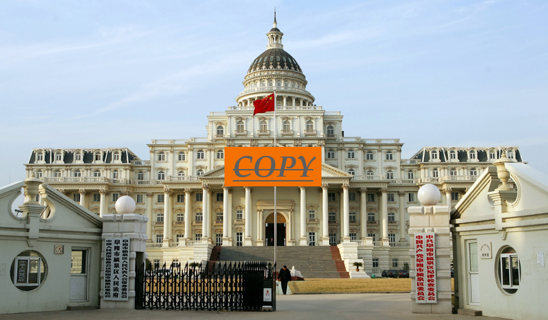 A large white building with a dome roof and a flag

Description automatically generated